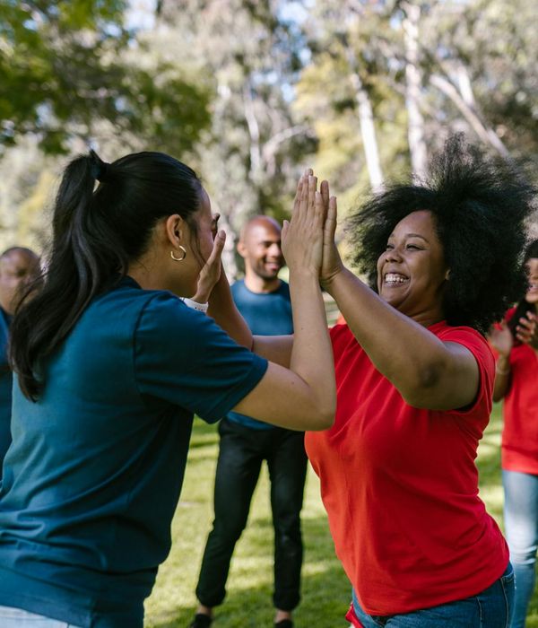 Group of diverse people smiling and feeling energetic.